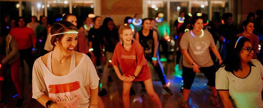 Zumba class with glow necklaces on